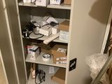 a metal cabinet with a lot of items on it