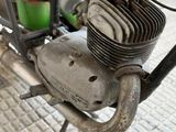 a close up of a motorcycle with a red engine