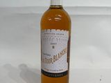 a bottle of liquor that is sitting on a table