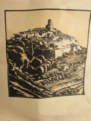 a black and white picture of a village on a hill