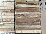a lot of books stacked on top of each other in a box