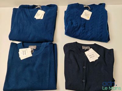 three pairs of men ' s blue and navy shirts with tags on them