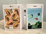 two paintings of birds and papanas on a table