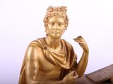 a statue of a woman holding a cigarette in her hand