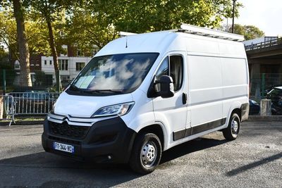 a white van that is parked in a parking lot