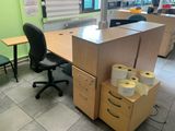 a desk with a lot of rolls of toilet paper on top of it