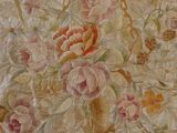 a picture of a wall hanging with a bunch of flowers on it