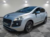 the small silver car is parked in a room with a checkered floor