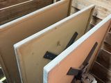 several pieces of wood are stacked on top of each other in a pile