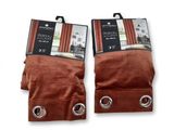 two pairs of brown curtains with metal rings on them