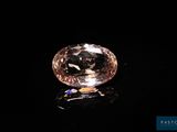 a pink diamond on a black surface
