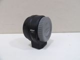 a camera lens sitting on top of a white table