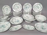 a lot of plates and bowls that are sitting on a table