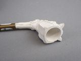 a pipe that is sitting on a table with a handle