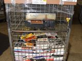 a metal cart with many items in it in a warehouse