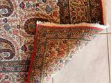 an image of a rug is laying on the floor next to a tile floor