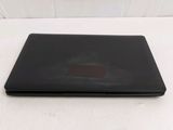 a black laptop computer sitting on a white surface