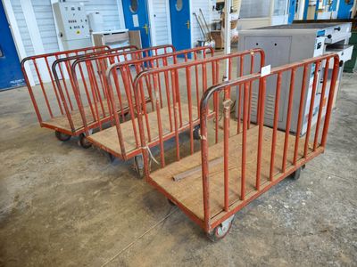 many carts that are lined up in a warehouse