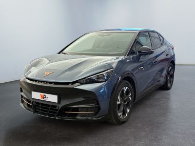 the blue car is parked in a large room with a black floor