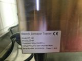 a label on the side of a toaster that says electric conveyor toaster