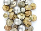 a lot of buttons that are on a white surface