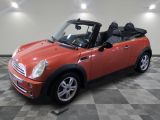 an image of a red mini cooper convertible