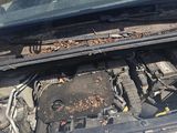 a car that has a broken engine in the back of it