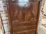 a wooden cabinet with a drawer on top of it