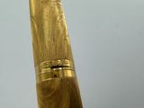 a close up of a gold colored pen with a white background