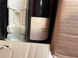 a bottle of wine that is sitting in a box