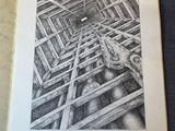 an open book with a pencil drawing of a man in a cage
