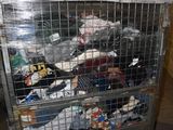 a metal cart filled with lots of trash in a room