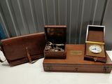 a small wooden box with a clock inside of it