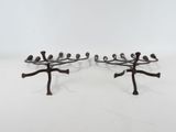 pair of metal birds on a branch candle holders