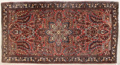 tapis persan ancien à motif floral sur fond rouge