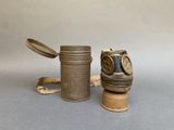 a gas mask and a canister on a table