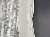 a close up of a piece of glass on a table