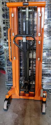 a forklift with a fork on top of it in a warehouse