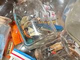 a pile of empty glass bottles on a table
