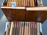 boxes of cigars are stacked on top of each other on a table