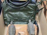 a box with a purse and a pair of binoculars in it