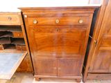 a wooden cabinet with drawers and drawers on it