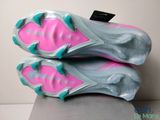 the soles of a pair of soccer cleats on a table