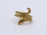 an image of a gold snake ring on a white surface