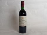 a bottle of wine that is sitting on a table