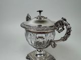 a silver cup that is sitting on a table