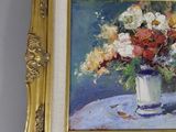 a painting of flowers in a vase on a table