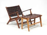 a chair and a foot stool sitting next to each other