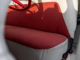 a red and white seat in the back of a car