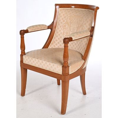 an image of a wooden chair with a beige upholstered seat